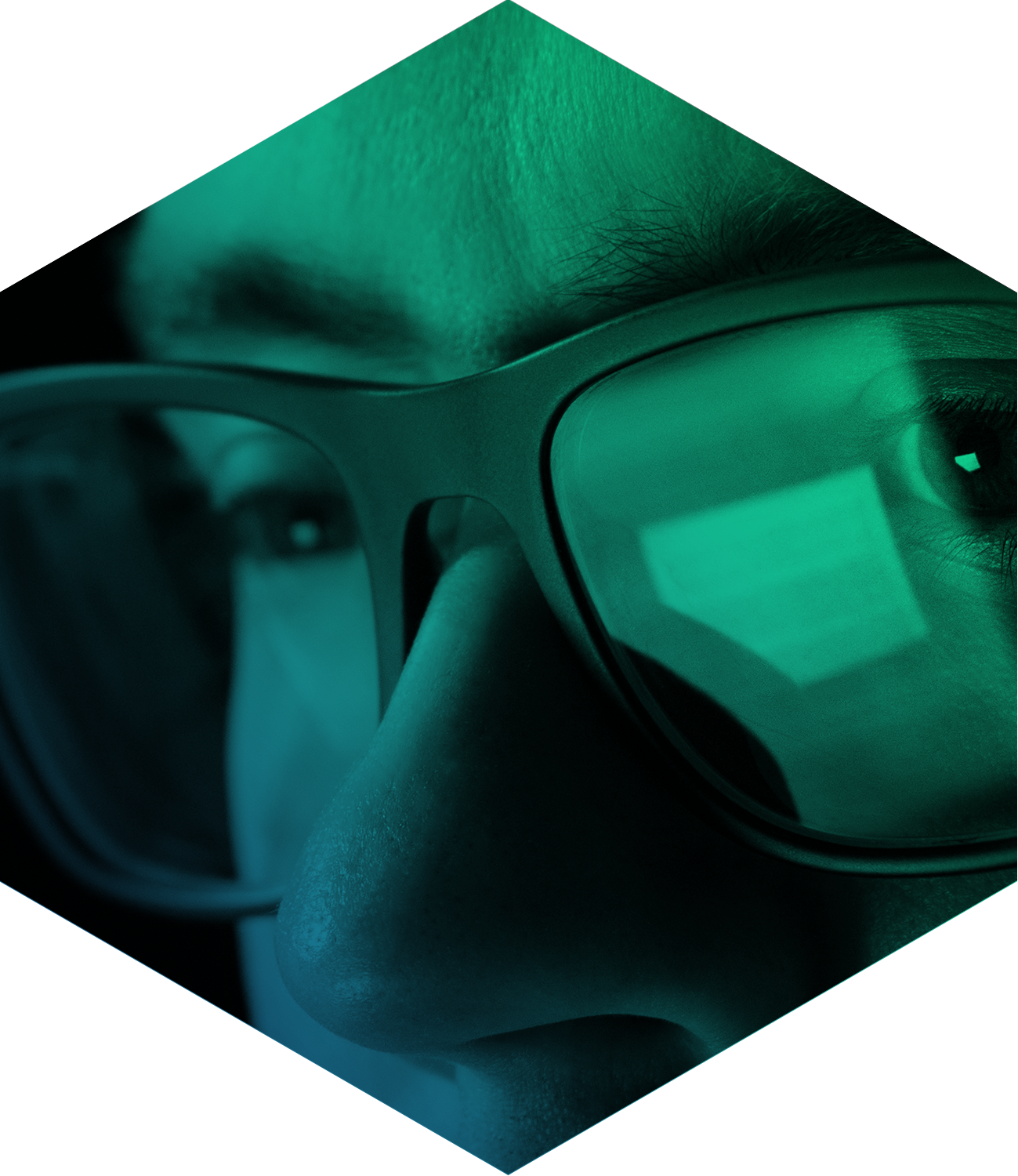 close up of a student with glasses seen through green filter