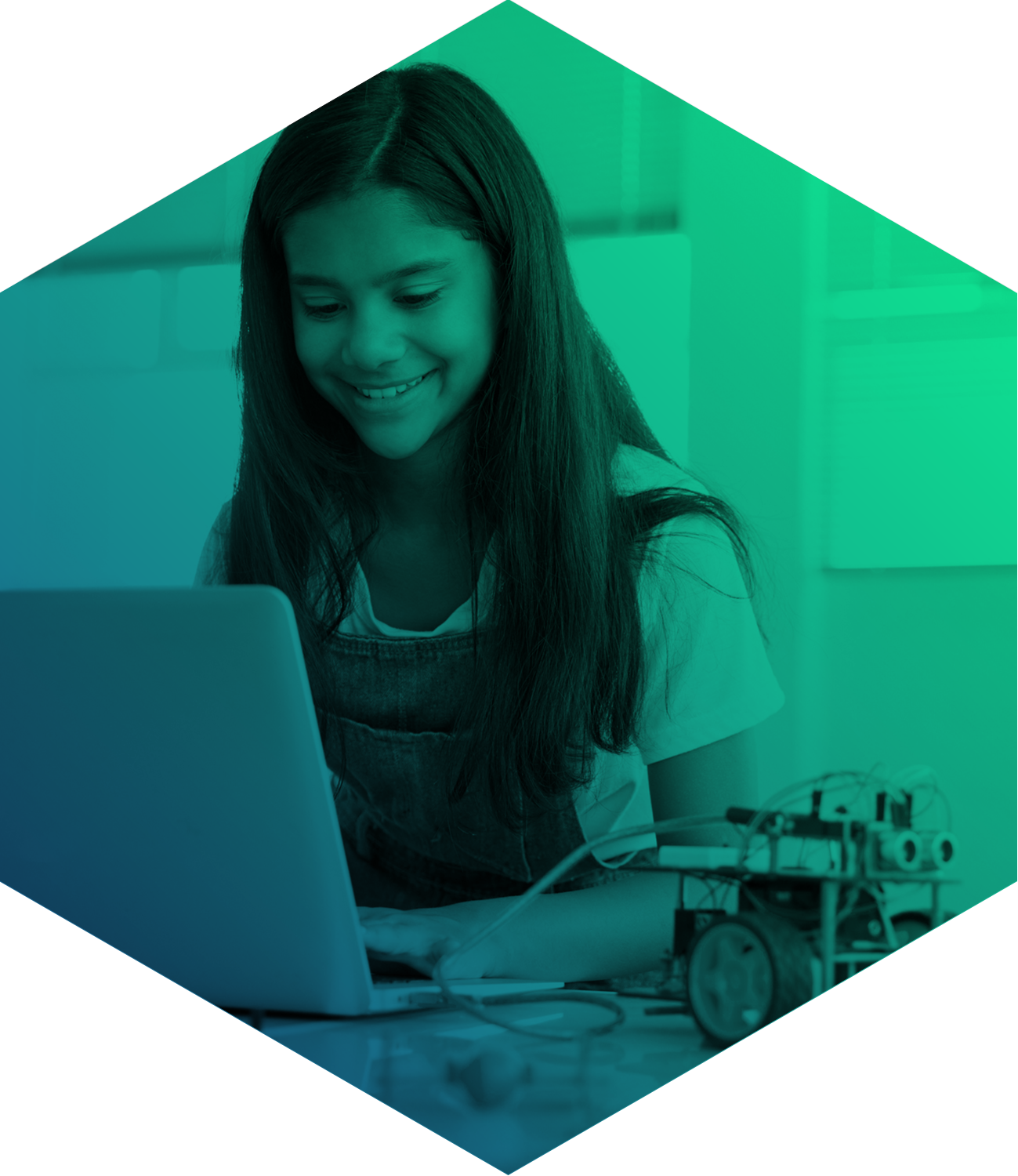 Girl typing on a laptop with a robot next to her seen through green filter