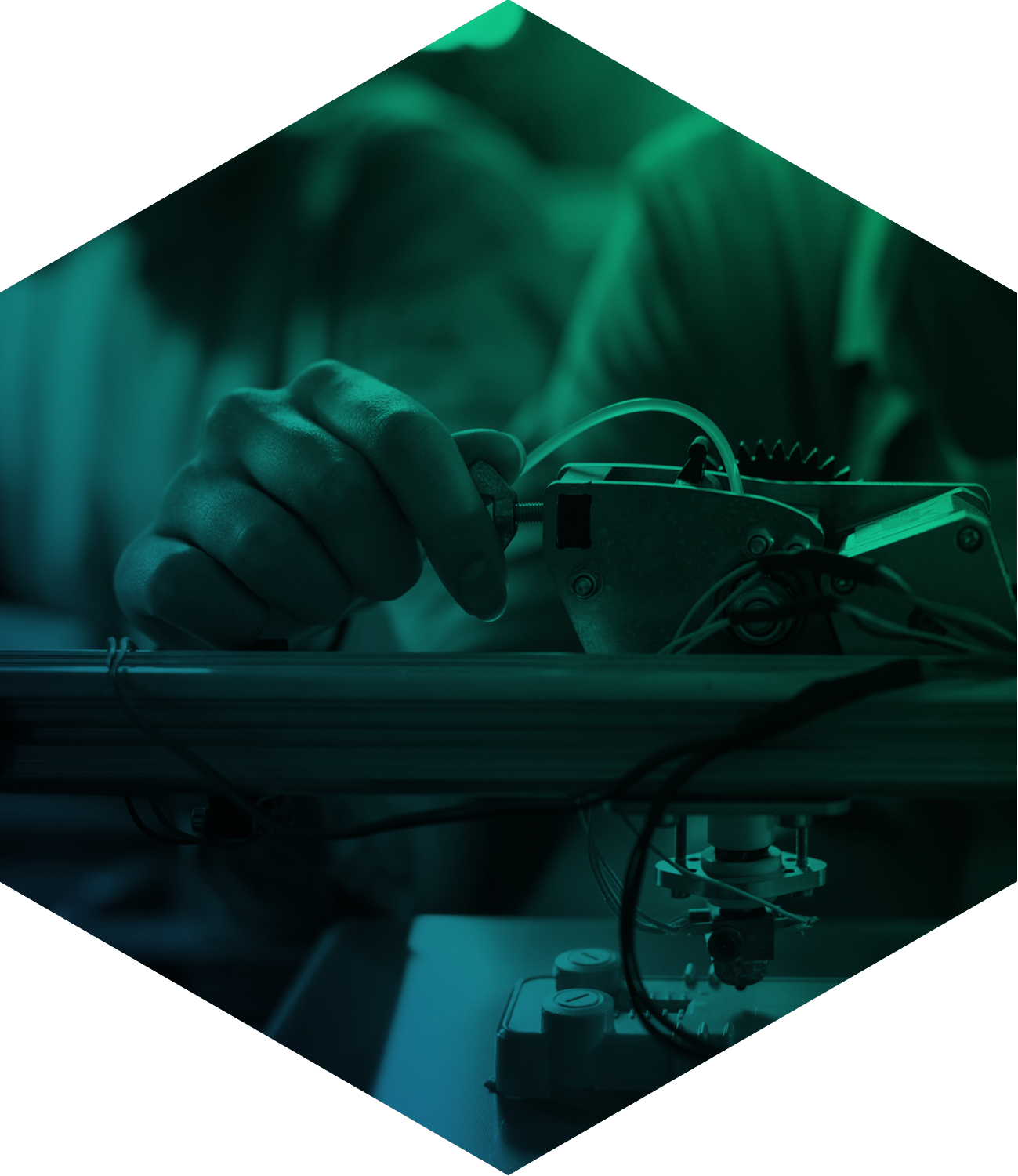 A hand adjusting a wing nut seen through a green filter